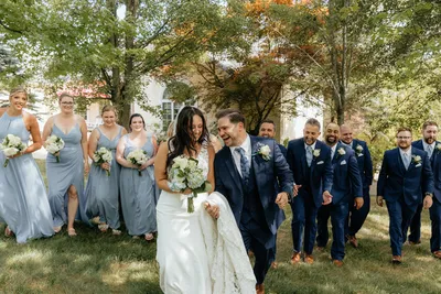 Newlywed couple with the wedding party