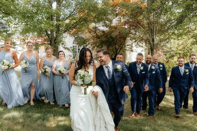 Newlywed couple with the wedding party